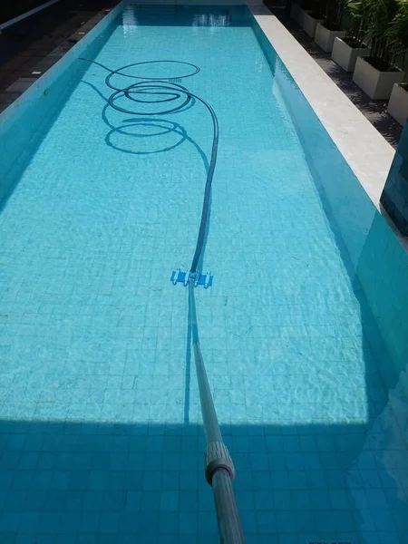 Swimming pool maintenance, pool cleaning equipment