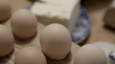 Eggs on an old baking table preparations for baking. High quality 4k footage