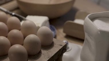 Eggs on an old baking table preparations for baking. High quality 4k footage