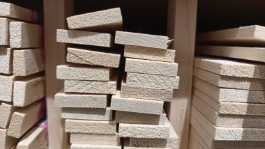 Small boards of different sizes are in the warehouse of the store. High quality photo
