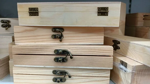 Wooden small boxes with a lock are on the counter in the store. High quality photo