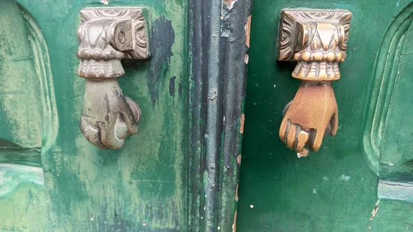 Decorative old handle from the front door and lock well above the handle. High quality photo