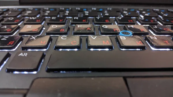 keyboard letters in English and Russian language, macro photography, dust on the keyboard. High quality photo