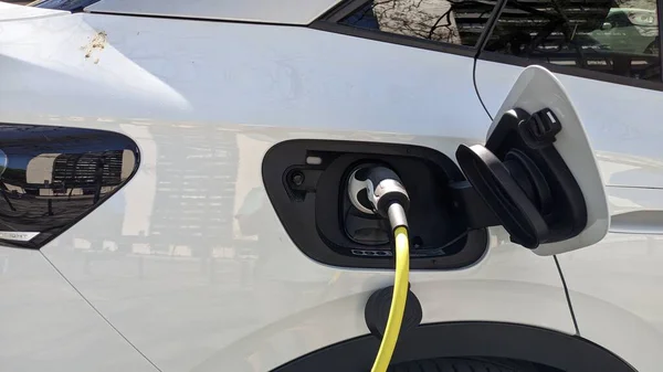 White Electric Car Parked Parking Lot Connected Electrical Grid Charging — Stock Photo, Image