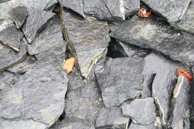 A closeup view highlighting the textured slate rocks, showcasing their intricate natural layers and rich colors clipart