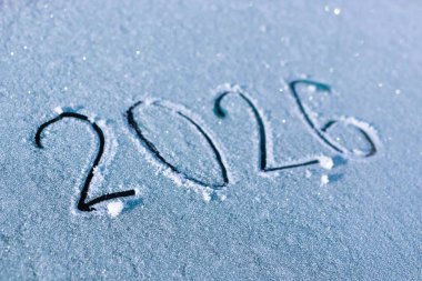 The year 2026 is elegantly carved in fresh, untouched snow, beautifully symbolizing exciting future possibilities clipart