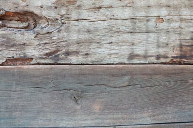 Herkesin hayran kalacağı güzel ve doğal dokular sergileyen taşralı, yıpranmış tahtaların yakın görüntüsü.