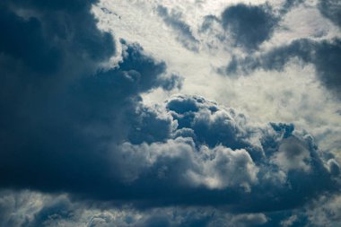 Puffy Backlit Cloudscape. High contrast.