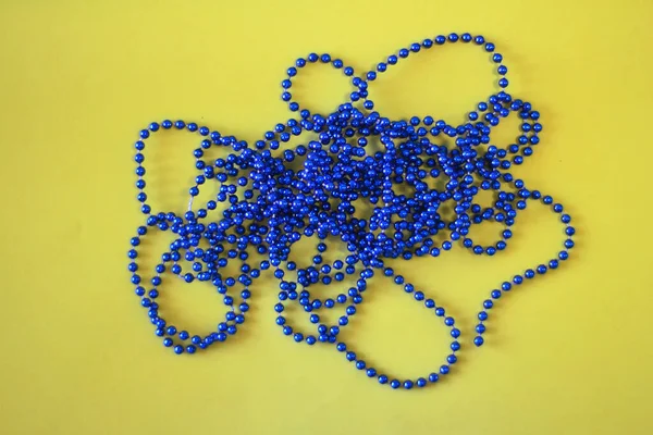 Blue Beads Yellow Background — Stock Photo, Image