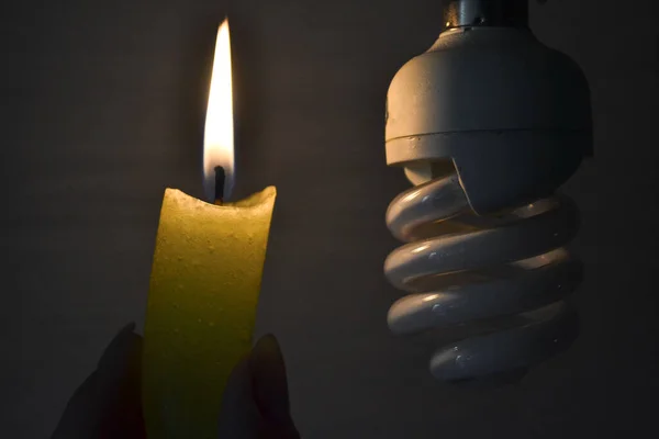 Lighted Candle Shines Light Bulb Dark — Stock Photo, Image