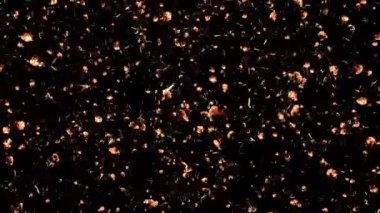 Ateş kül ya da toz parçacıkları, havada bir döngü içinde uçuyor ve yüzüyor, bu karede siyah bir arkaplanı alfa kanalıyla örtüyor..