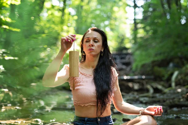 Yoga woman. Mindfulness with calm sounds in forest. Girl practicing pranayama and meditate. Morning with relax routine.