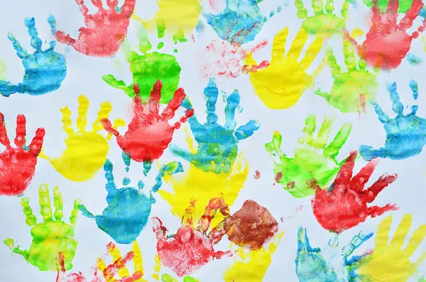 Stock image Diffrent colour of little hands on lesson in nursey school. Handprint of child.