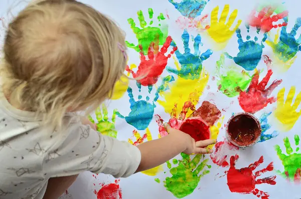 Little Girl Paints Nursey School White Background Multicolor Imprint Hands — Stock Photo, Image