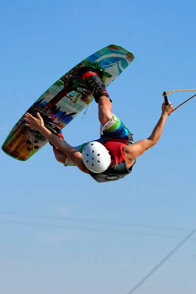 Wakeboarder Mid Air Flying Upsede — Stock Photo, Image