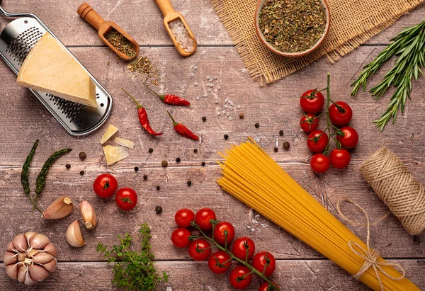 stock image Flat lay photography of raw spaghetti; tomato; pasta; garlic; ingredient