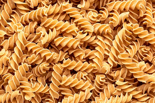生のひよこ豆のパスタのマクロ空白の写真 フュージリ マカロニ グルテンフリー スパイラル イタリア語 伝統的な ベジタリアン — ストック写真