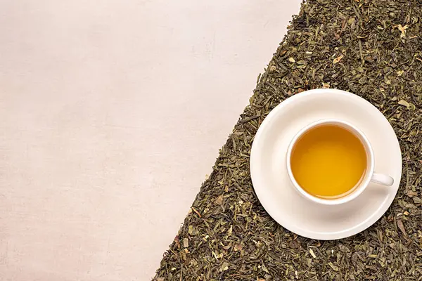 Blank photography of green tea; herb; herbal; dry; natural; drink; petal; mug; cup; hot; grass; beverage; jasmine; leaf; healthy
