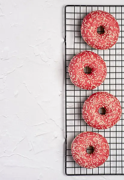 Blank food photography of donuts, glazed, bagel, bakery, baking, pastry, pink, treat, dessert, sprinkles, calories, icing, candy,
