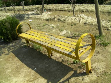 Bench in the park, yellow bench in the park. clipart