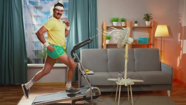 Funny Man Retro Style Sportswear Uses Running Machine — Stock Video