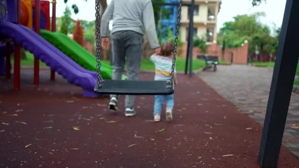 Criminal Male Abductor Leads Child Hand Playground — Stock Video