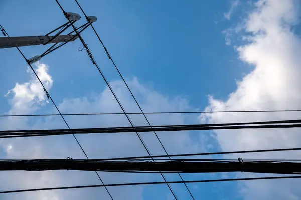 stock image Street lights and high voltage towers have the sunset sky as the background.