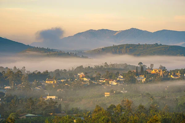 stock image Mountains during dawn. Beautiful natural landscape in the summer time. Beautiful sunrise in foggy mountains in Bao Loc, Vietnam