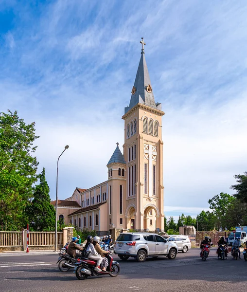 stock image Da Lat, Viet Nam - 3 June 2023: Looking towards Da Lat Cathedral, Chicken Church on a green road, located in Da Lat city, Lam Dong province. Tourism city in Vietnam developed.