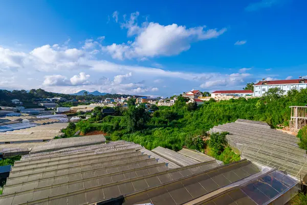 stock image Green Houses Spread Across The Mountain Village Of Da Lat City In Vietnam