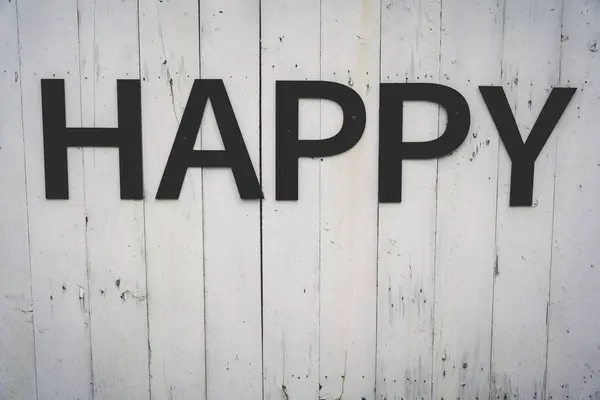Eski ahşap arka planda Happy yazılıydı. Eski tarz. Yazı, üst görünüm, metin için tablet için kopyalama yeri
