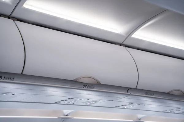 Carry Luggage Stowed Overhead Bins Crowded Airplane — Stock Photo, Image