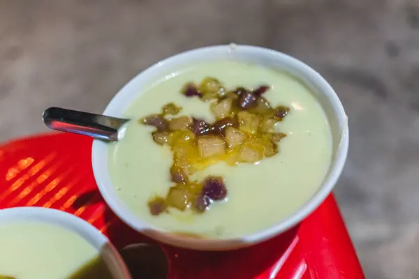 stock image Bowl of tofu soup and coconut milk with ginger sweet syrup