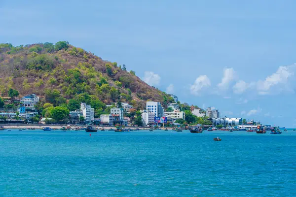 stock image Vung Tau, Vietnam May 4 2024: Panoramic coastal Vung Tau view, with waves, coastline, streets, coconut trees and Tao Phung mountain in Vietnam. Travel concept