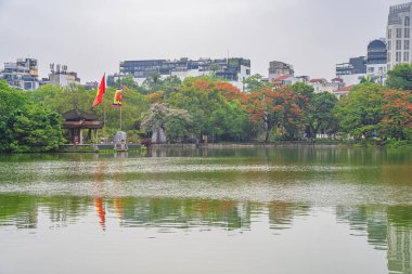 Hanoi, Vietnam - 26 June 2024: Turtle Tower (Thap Rua) in Hoan Kiem lake (Sword lake, Ho Guom) in Hanoi, Vietnam. clipart