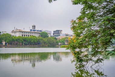 Hanoi, Vietnam - 26 June 2024: Turtle Tower (Thap Rua) in Hoan Kiem lake (Sword lake, Ho Guom) in Hanoi, Vietnam. clipart