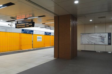 Ho Chi Minh city, Vietnam - 15 Dec 2024: Interior view of the metro train entering the Opera House station. An intermodal transfer station complex, part of the Ho Chi Minh City Metro 01 system. Travel concept. clipart