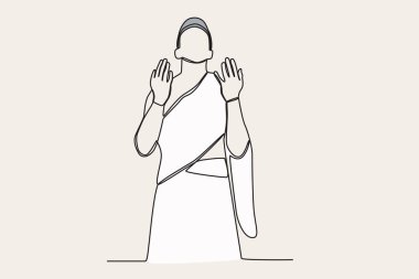 Bir kadın kutsal yolculuğu yapıyor. Hac ziyaretçileri tek sıra halinde...