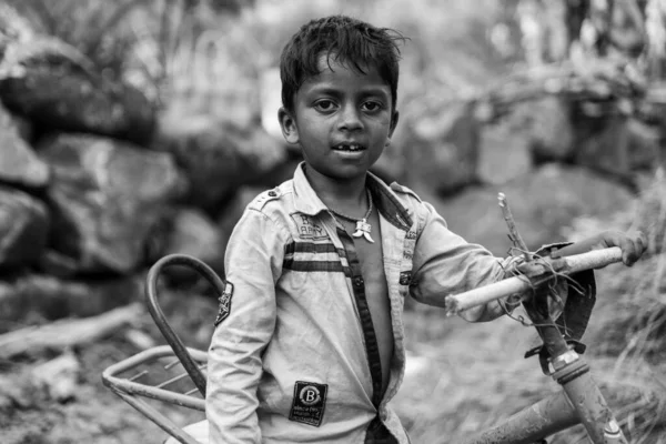 Poor Little Boy Stands Dusty Village Street Holding Broken Bicycle — Stock Photo, Image