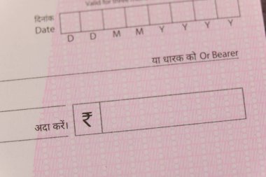 A macro photo of a cheque, highlighting specific details india clipart