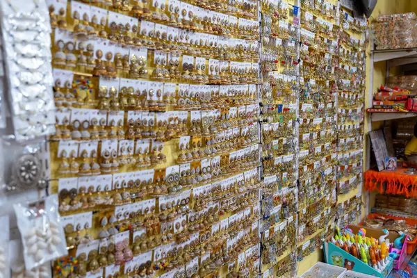 stock image This image is from Gokarna City, State Karnataka Country India, on 17th May 2024. A vibrant display of traditional Indian jhumka earrings in a bustling market, bursting with color and intricate details.