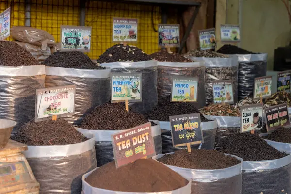 stock image This image is from Gokarna City, State Karnataka Country India, on 17th May 2024. Bags overflowing with aromatic black tea blends entice customers at a vibrant Indian spice market