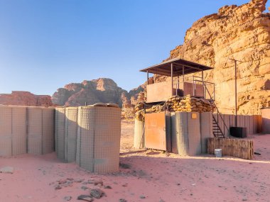 Dry Arid desert landscape under the clear blue sky in a hot summer day. Desert landscape and canyon rock formations