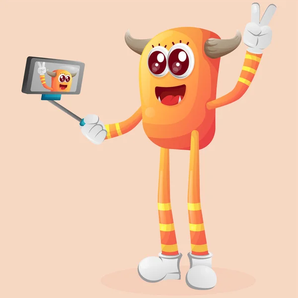 可愛いオレンジモンスターがスマホで自撮り 中小企業や電子商取引 商品やステッカー バナープロモーション ブログやVlogチャンネルに最適です — ストックベクタ