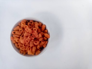 macaroni in wooden bowl on white background.