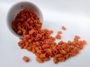 macaroni in wooden bowl on white background.