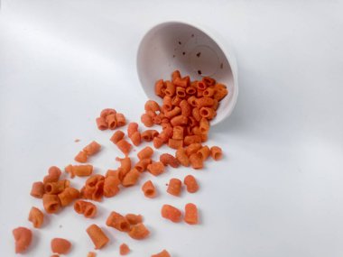 macaroni in wooden bowl on white background.