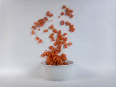 macaroni in wooden bowl on white background.
