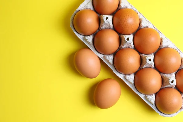 stock image fresh farm eggs on a colored background. High quality photo