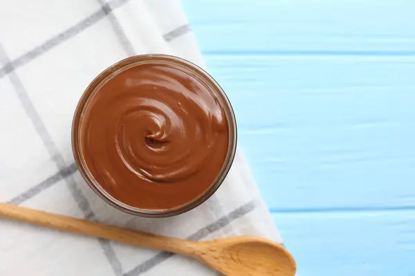chocolate paste with a bowl on a table. . High quality photo